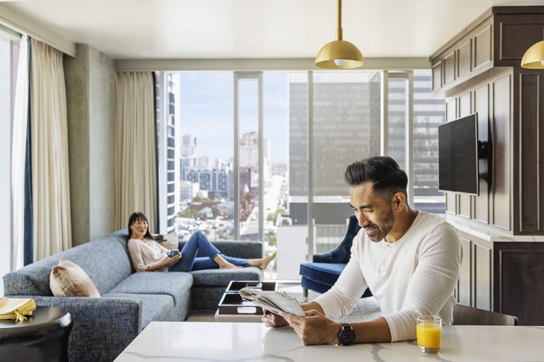 A couple relaxing in a King Suite